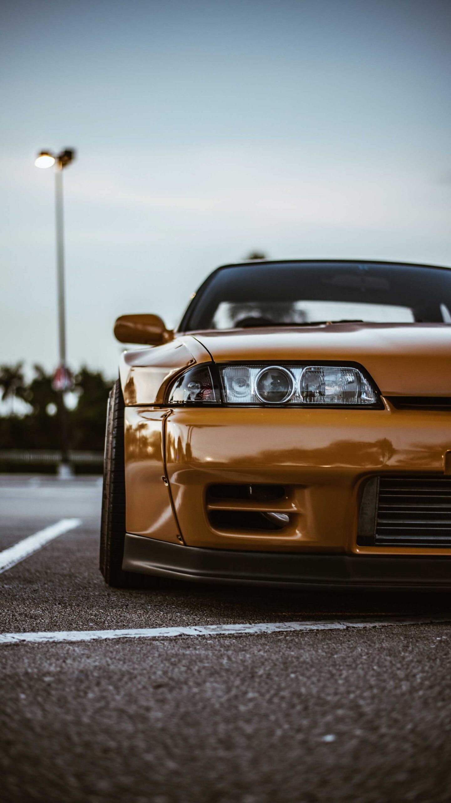 josh-berquist-yellow-car custom car on asphalt
